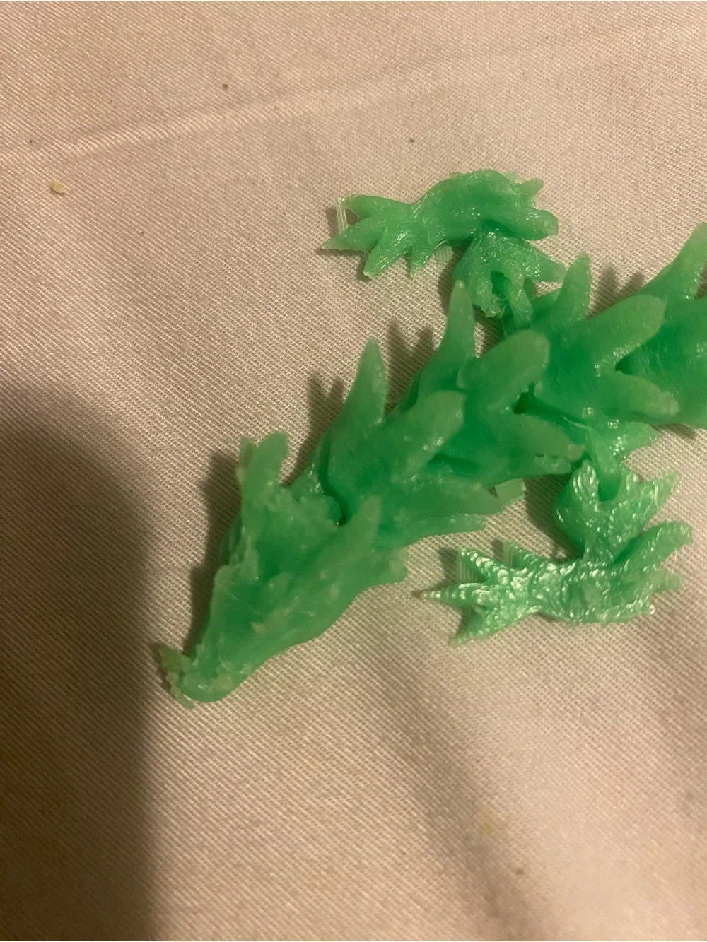 3-D green printed articulated dragon